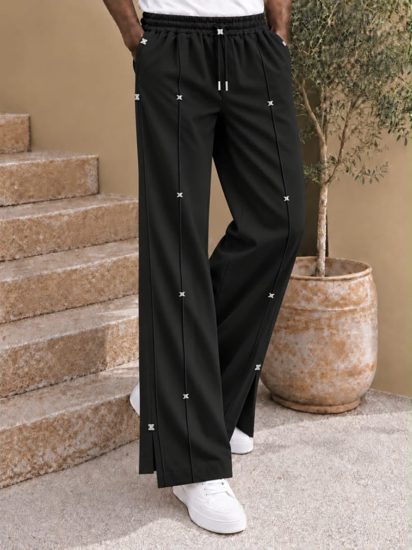 Pantalon large à nervures et attaches métalliques