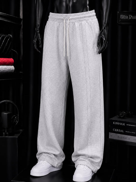 Pantalon large gris à pli marqué
