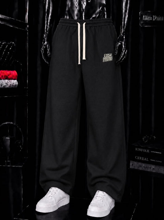 Pantalon jogging noir écusson crème
