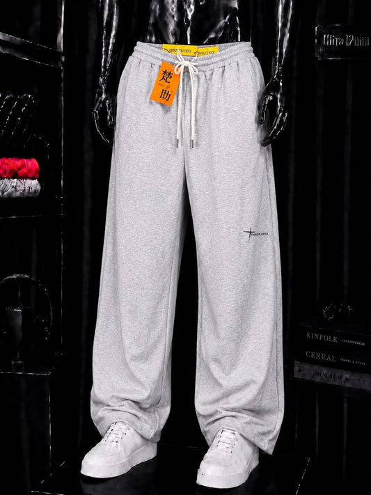 Pantalon jogging gris motif croix