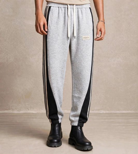 Pantalon jogging gris resserré panneaux noirs — Tendressa