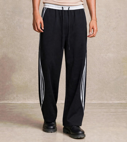 Pantalon jogging noir bandes blanches courbées — Tendressa