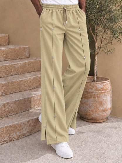 Pantalon large à nervures et attaches métalliques