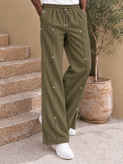 Pantalon large à nervures et attaches métalliques